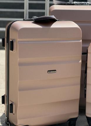Ударопрочный wings средний чемодан дорожный m на колесах польша 75 литров4 фото