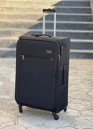 Облегченный средний чемодан дорожный тканевый m  на колесах  с подшипником6 фото