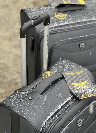 Средний чемодан дорожный тканевый m польша на колесах wings с подшипником5 фото