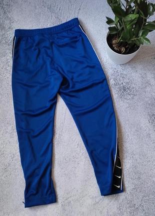 Чоловічі спортивні штани з лампасами nike sportswear pant — indigo tech7 фото