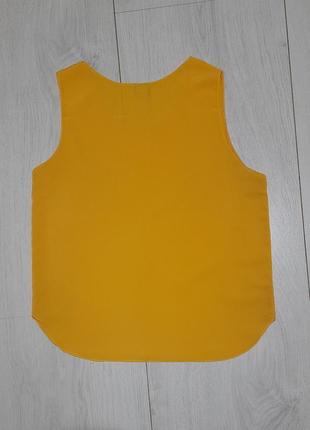 Блуза без рукавів,  насиченого жовтого кольору.4 фото