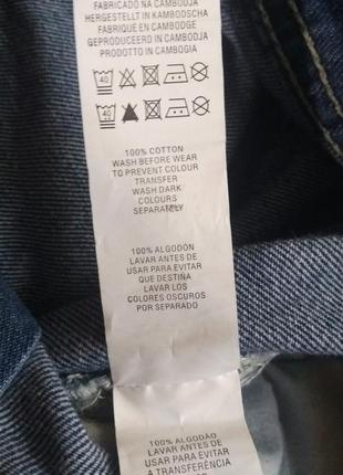 Джинсовий брючний комбінезон штанами на заклепках з рванностями потертостями10 фото