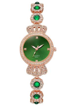Жіночий кварцовий наручний годинник з безліччю білих фіанітів королівський шарм золотисті1 фото