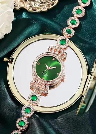 Жіночий кварцовий наручний годинник з безліччю білих фіанітів королівський шарм золотисті2 фото