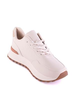 Жіночі світло-бежеві кросівки на шнурівці1 фото