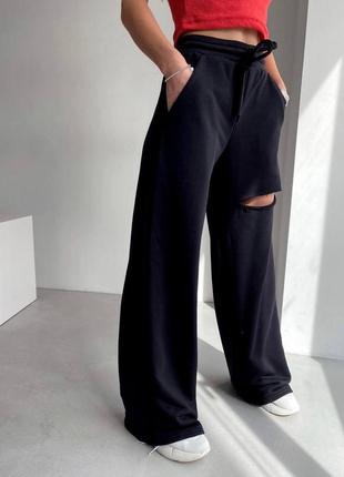 Стильні жіночі штани з розрізом