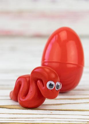 Антистрес жуйка для рук хендгам яйце з аксесуарами 15г (червоний)1 фото