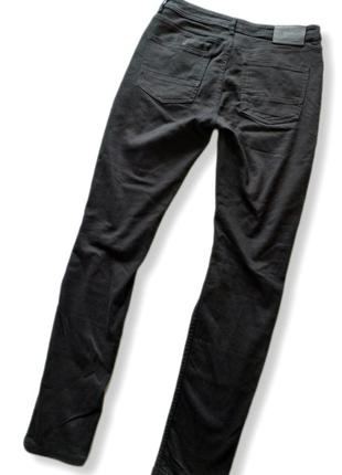 Рваные стрейчевые джинсы с потертостями3 фото