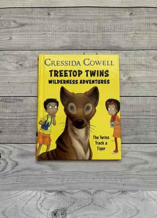 Дитяча книга англійською treetops twins wilderness adventures by cressida cowell