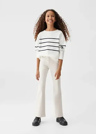 Білі нові бежеві брюки джинси з розрізами