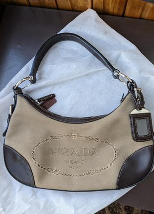 Сумочка prada brown leather and beige canvas logo canapa shoulder bag