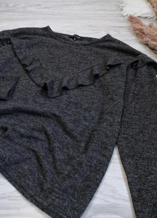 Плюшевый серый меланжевый свитер с рюшей2 фото