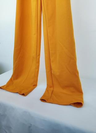 Оранжевый комбинезон брюками4 фото