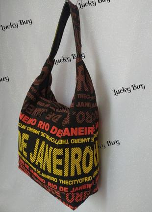 Женская текстильная черная сумка с яркими надписями3 фото