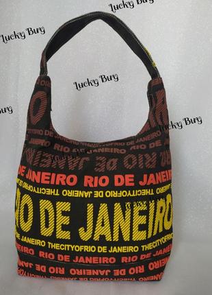 Жіноча текстильна чорна сумка з яскравими написами2 фото