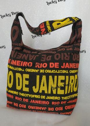 Жіноча текстильна чорна сумка з яскравими написами1 фото