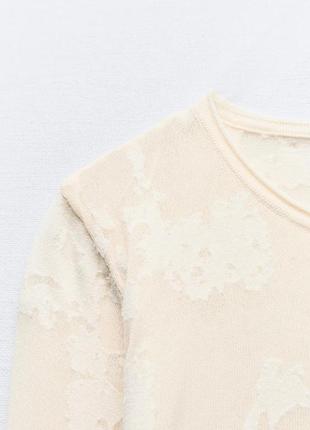 Трикотажний светр із плямистою текстурою9 фото