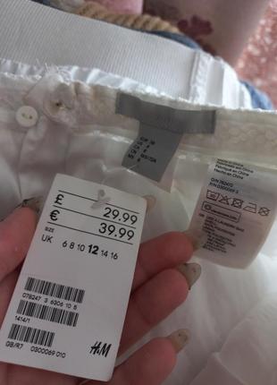Расклешенная юбка из фактурной ткани со складками на талии4 фото