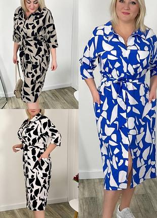 Платье свободного кроя, с накладными карманами.