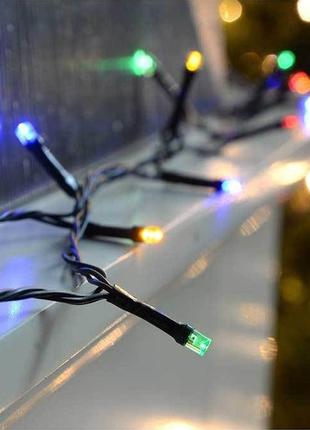 Новогодняя гирлянда с яркими разноцветными лампочками 10 метров и черным шнуром с вилкой для розетки2 фото