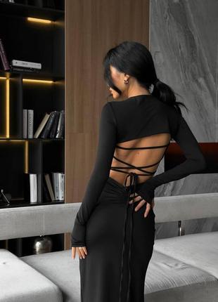 Женское стильное облегающее длинное черное платье с завязками на спинке и разрезом на ножке трендово3 фото
