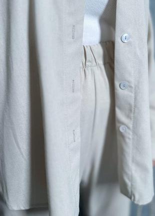 Льняной костюм с удлиненной рубашкой с пуговицами со свободными брюками с резинкой в поясе3 фото