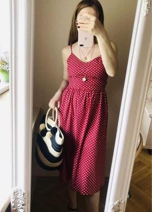 Літній сарафан в горошок з бантом на спині