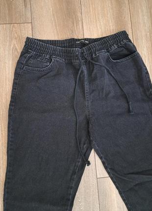 Брюки джинсовые черные на манжетах2 фото