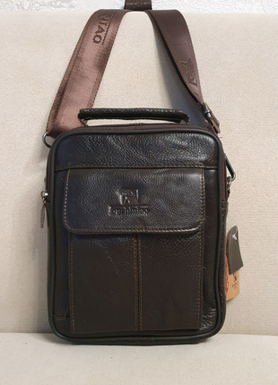 Чоловіча сумка fuzhiniao 66032-3
із натуральної шкіри.2 фото
