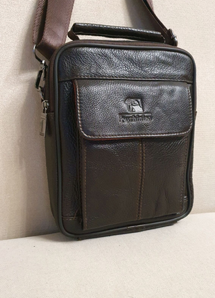Чоловіча сумка fuzhiniao 66032-3
із натуральної шкіри.3 фото