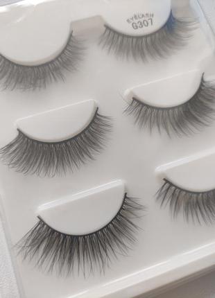 Нові накладні вії 6 шт. 3 пари 3d eyelash
натуральні тонкі чорні смужками3 фото