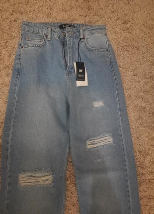 Новые джинсы с рваностями3 фото