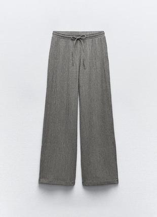 Текстурные объемные брюки5 фото