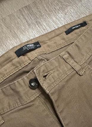 Штани/джинси коричневі прямі2 фото