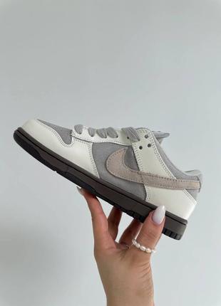 Класні жіночі кросівки nike sb dunk low grey white gum білі з сірим5 фото