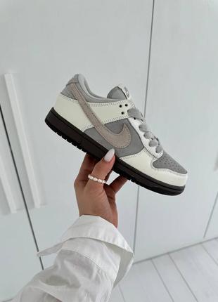 Класні жіночі кросівки nike sb dunk low grey white gum білі з сірим6 фото