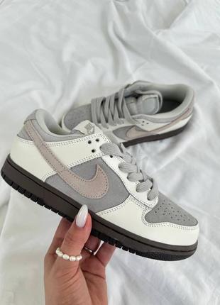 Класні жіночі кросівки nike sb dunk low grey white gum білі з сірим3 фото