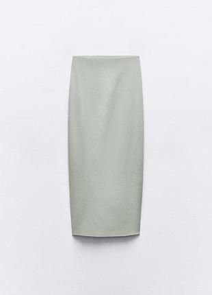 Эластичная юбка средней длины8 фото