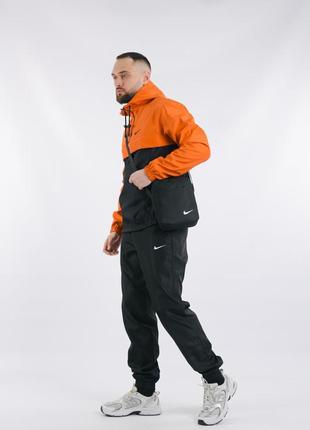 Комплект чоловічий в стилі nike: анорак помаранчево-чорний + штани чорні. барсетка  у подарунок!4 фото