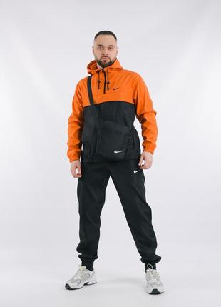 Комплект мужской в стиле nike: анорак оранжево-черный + брюки черные. борсетка в подарок!1 фото