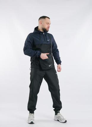 Комплект мужской в стиле nike: анорак сине-черный + брюки черные. борсетка в подарок