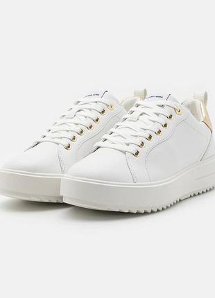 Оригинальные кожаные белые женские кроссовки michael kors emmett leather sneaker с фирменным логотипом кеды сникерсы золотистые золотые кожа оригинал3 фото