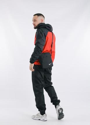 Комплект весенний мужской в стиле nike: анорак черно-красный + брюки черные + борсетка в подарок4 фото