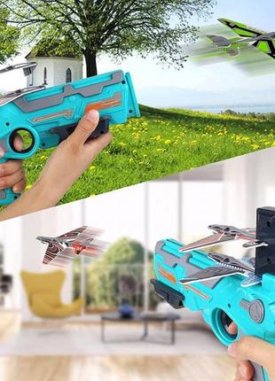 Детский игрушечный пистолет с самолетиками air battle катапульта с летающими самолетами (ab-1). цвет: синий5 фото