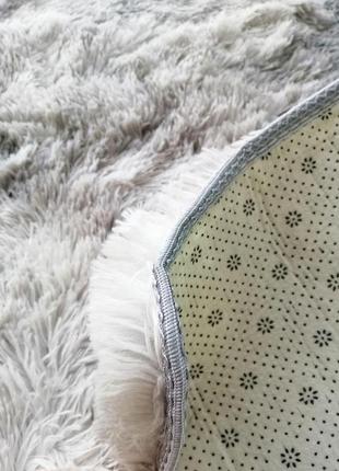 Плюшевий пухнастий килимок сірий із переливом кольору