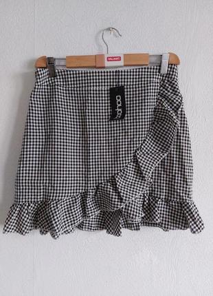 Шикарна спідниця у клітинку з рюшею