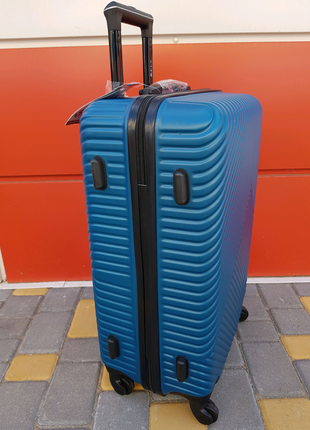 Добротный средний чемодан фирмы fly 2702 m6 фото