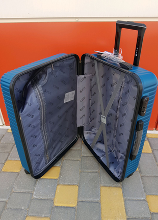 Добротный средний чемодан фирмы fly 2702 m10 фото