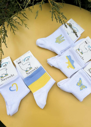 Набір з 10 пар білих шкарпеток з українською символікою1 фото