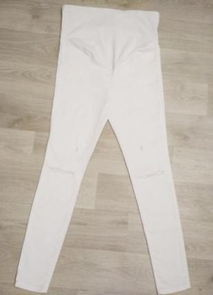 Рваные белые джинсы для беременных.2 фото